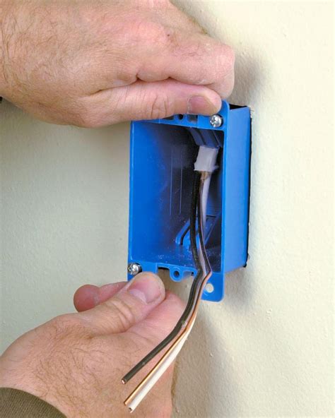 attaching electrical outlet box to wall|installing electrical box on drywall.